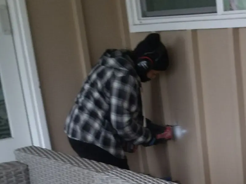 Professional electrician installing an exterior outlet in Lancaster